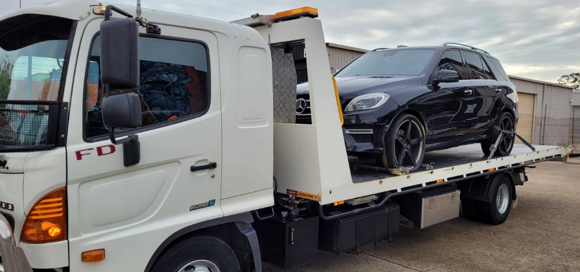 Motorcycle secured on tray
